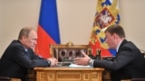 RUSSIA -- Russian President Vladimir Putin (L) and Pskov region governor Andrei Turchak meet for talks at Novo-Ogaryovo residence, December 16, 2013